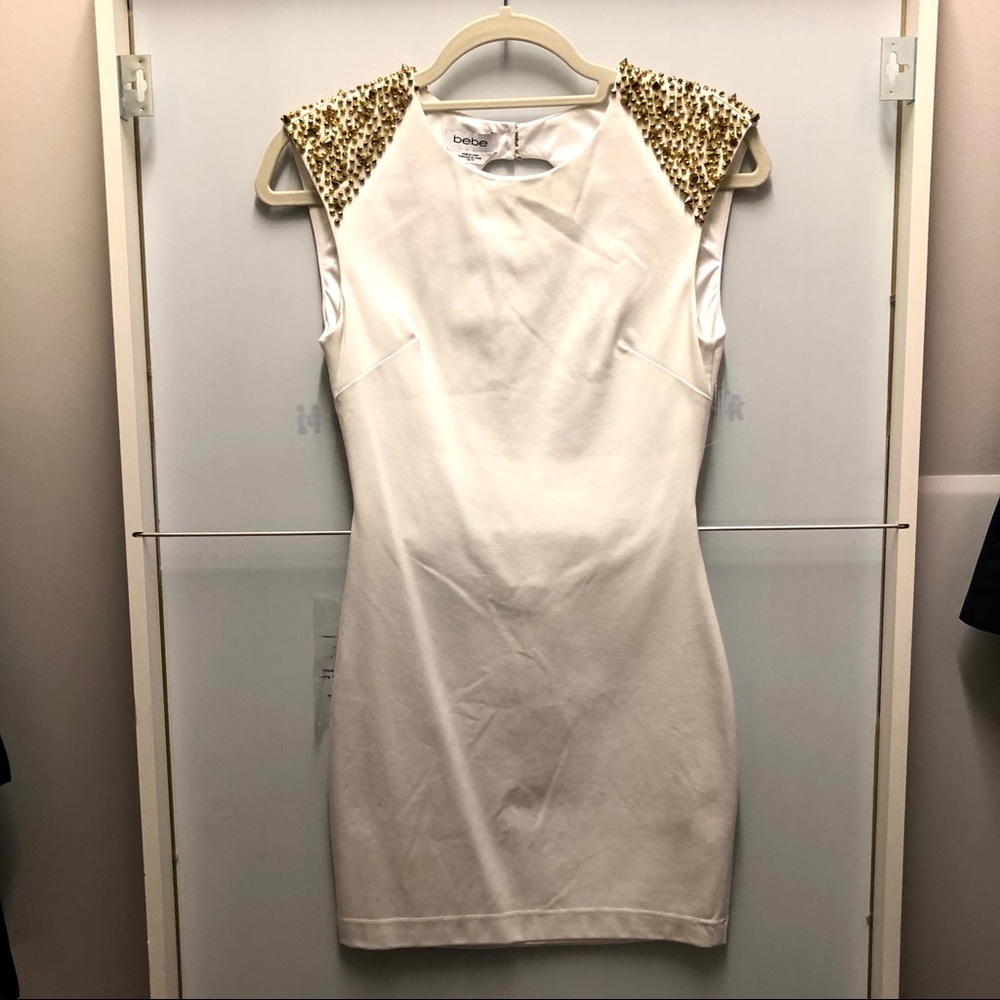 NWT Bebe bodycon dress with gold spikes XS